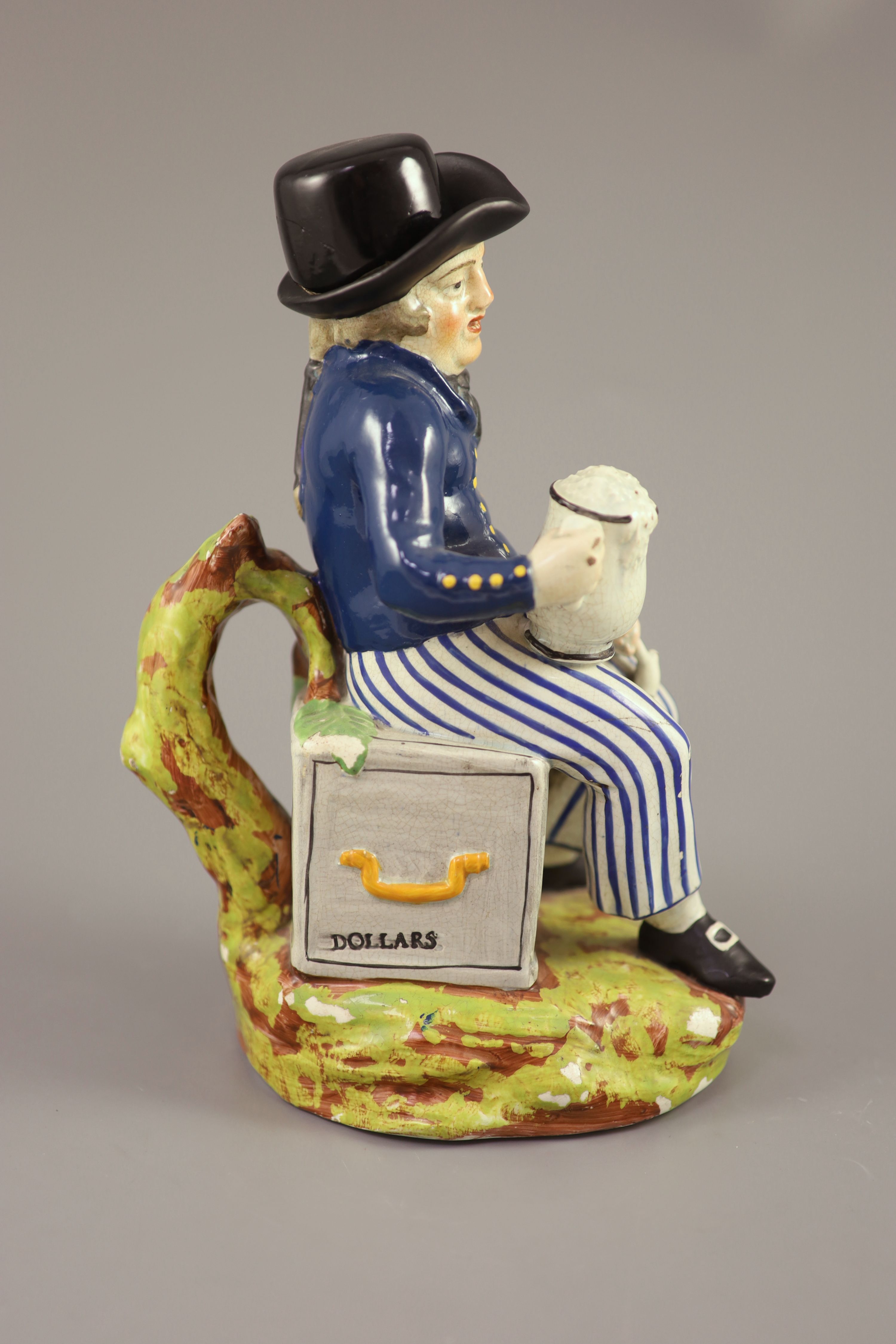 An American Pearlware sailor Toby jug with hat, Success to our Wooden Walls, c.1820, 27cm high